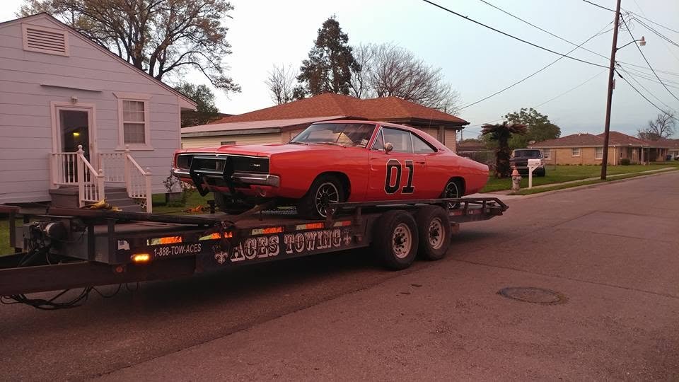 Orange 1969 Charger on an Aces Towing trailer