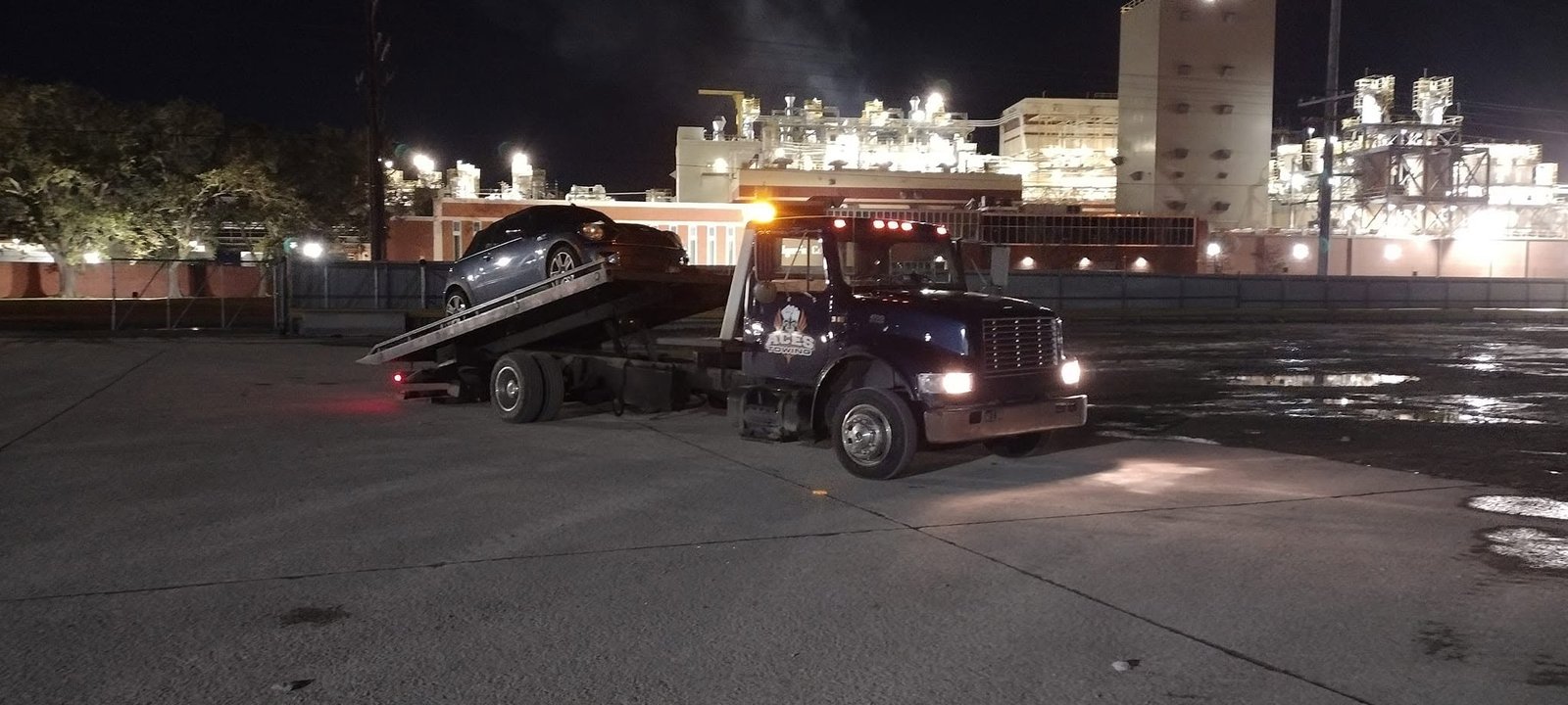 Night tow out of a plant parking lot